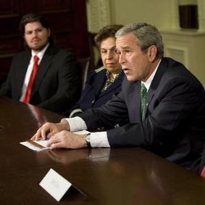 A photo of President Bush making an announcement. Accompanying Josh White's Washington Post article, "Dole, Shalala to Lead Troop-Care Panel."