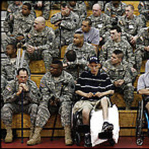 A photo of an injured veteran amongst other veterans.